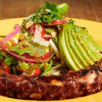 Pulpo · Grilled Spanish octopus, served over arugula, avocado, cherry tomatoes, red onions.