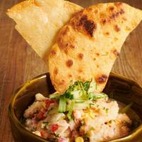Ceviche · Mixed seafood cured in lime juice, cucumber, bell peppers, onions.