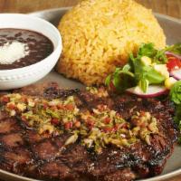 Steak A La Mexicana · Ribeye-certified Angus beef and chimichurri sauce. Served with arugula salad, rice, and frij...