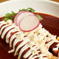 Enchiladas · Served with rice and frijoles.
