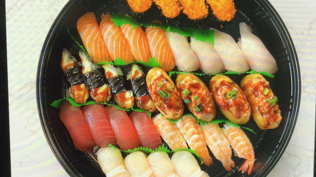 #10. Premium Nigini Platter  · 32 piece,4 piece each of Japanese scallops,ahi,Ebi,Unagi,spicy ahi bomb, salmon ,hamachi and masago
