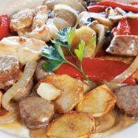 Chicken Scarpariello · Sausages, Onions, Mushrooms, Potatoes, Sweet Peppers.