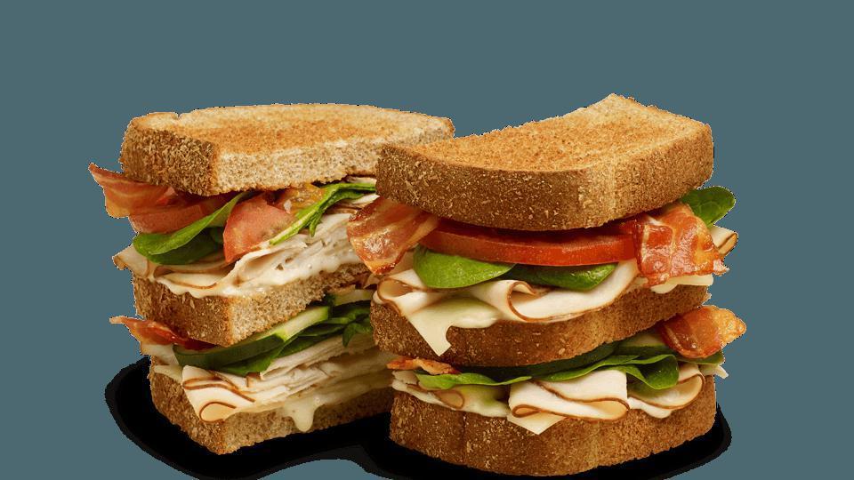 Club Sandwiches - Turkey Veggie Ranch · Contains: Swiss, Ranch Dressing, Tomato, Cucumbers, Spinach, Applewood Smoked Bacon, Oven Roasted Turkey