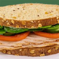 Stacked Sandwich - Turkey Veggie · Contains: Multi Grain Bread, Spinach, Cucumbers, Tomato, Mayo, Meat