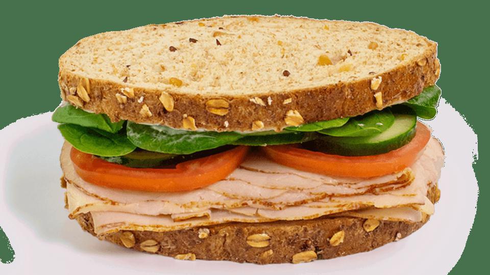 Stacked Sandwich - Turkey Veggie · Contains: Multi Grain Bread, Spinach, Cucumbers, Tomato, Mayo, Meat