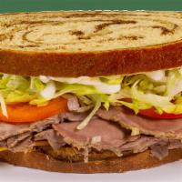 Stacked Sandwich - Roast Beef · Contains: Marble Rye, Lettuce, Onions, Tomato, Mayo, Meat