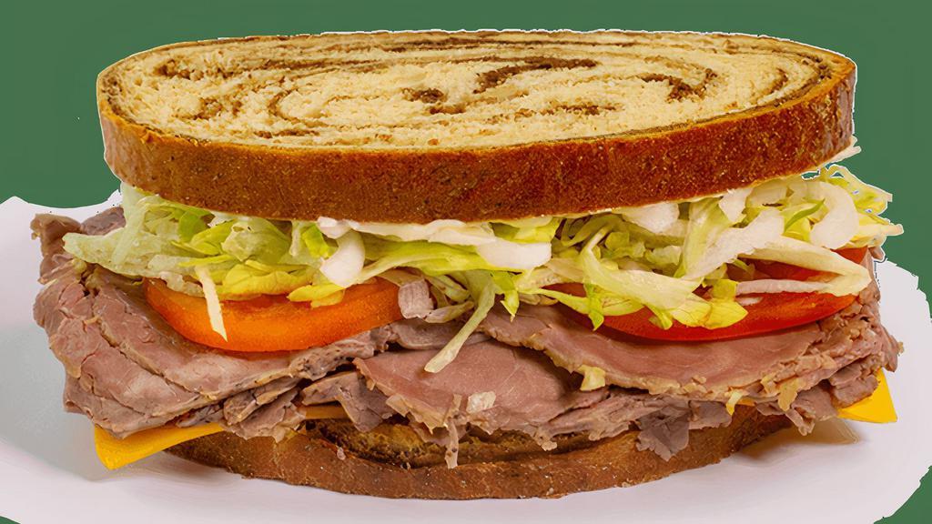 Stacked Sandwich - Roast Beef · Contains: Marble Rye, Lettuce, Onions, Tomato, Mayo, Meat