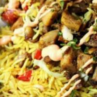 Halal Style Chicken & Rice · Marinaded grilled chicken, basmati rice, lettuce, tomato, white sauce, hot sauce, and varm p...