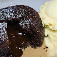 Chocolate Souffle · with milk chocolate sauce & bourbon-brown sugar ice cream
