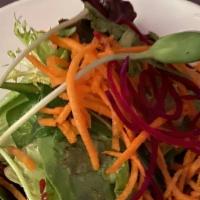 Raw Sea Vegetable Salad · Gluten free. Mix greens, wakame, dulse, carrots, onions mix, sesame seeds, tomato, fresh gar...