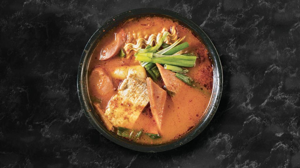 Budae Jjigae · Spicy. Kimchi stew with sausage, ham, tofu and ramen noodle.