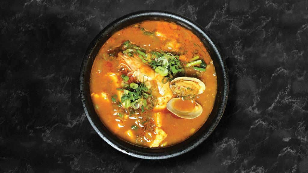 Dwenjang Jigae · Savory soybean paste stew with vegetables ( beef or seafood).