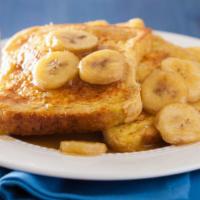 3 Slices Of French Toast With Banana · 3 Perfectly cooked French Toast slices, topped with fresh banana slices.