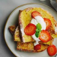 3 Slices Of French Toast With Strawberries · 3 Perfectly cooked French Toast slices, topped with fresh strawberries.