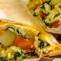 Veggie Breakfast Wrap · Delicious Breakfast wrap topped with 2 Eggs, Onions, Peppers, Tomatoes & Mushrooms. Served o...