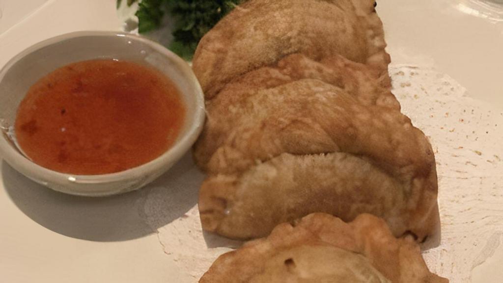 Curry Puff · Chicken, potatoes and onion filling in a delicate crispy shell.