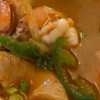 Tom Yum Koong · Hot & spicy. Shrimp soup with lime juice, lemongrass and hot chili paste.