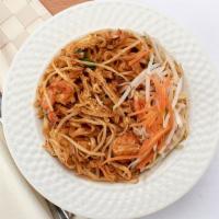 Pad Thai · Rice noodles tossed in a savory sauce with chicken or shrimp, green onions, tofu, eggs and c...