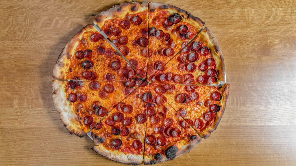 Pepperoni Pizza · Red sauce, roni cups, mozzarella, and chili flake.