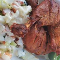 Chicken Tandoori · Two pieces Tandoori chicken with lettuce & chutney.