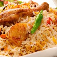 Chicken Biryani · Pieces of tender chicken mixed with savory rice and a blend of spices. Chicken Biryani