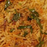 Lamb Biryani · Sauteed in herbs and rich spices cooked with fragrant rice and garnished with fried onions n...