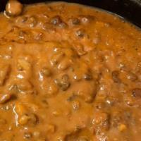 Dal Makani · Black lentils simmered with spices & light cream.