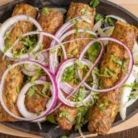 Chicken Shish Kebab · Ground chicken prepared with ginger/garlic paste and herbs, cooked in tandoor oven.