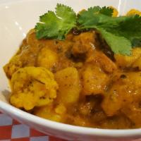 Aloo Gobi · Vegetarian. Cauliflower florets, potatoes cooked with onions, tomatoes, flavored with curry ...
