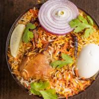 Chicken Dum Biryani · Chicken with bone cooked in Basmati rice with special herbs and spices.