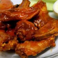 6 Buffalo Chicken Wings · Simplicity is the name of the game: 6 fresh chicken wings that are fried to perfection soake...