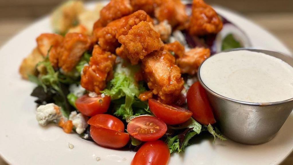 Buffalo Style Chicken Salad (Popular) · Romaine lettuce, cheddar cheese, red onions, tomatoes, mixed with warm buffalo chicken with blue cheese dressing on the side.