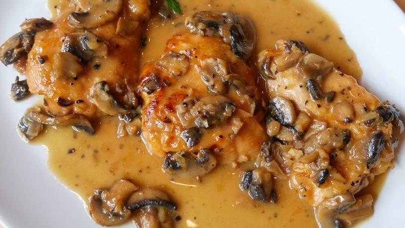Traditional Chicken Marsala · Pan seared chicken, earthy cremini mushrooms braised in a rich marsala wine sauce. Served with mashed potatoes and sauteed spinach.