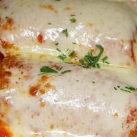 Traditonal Eggplant Parmesan Dinner · Breaded Eggplant Rolled with Ricotta Topped with Tomato Sauce and Mozzarella.