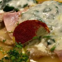 Chicken Saltimbocca · Pan seared chicken breast layered with prosciutto di parma and fresh mozzarella braised in a...