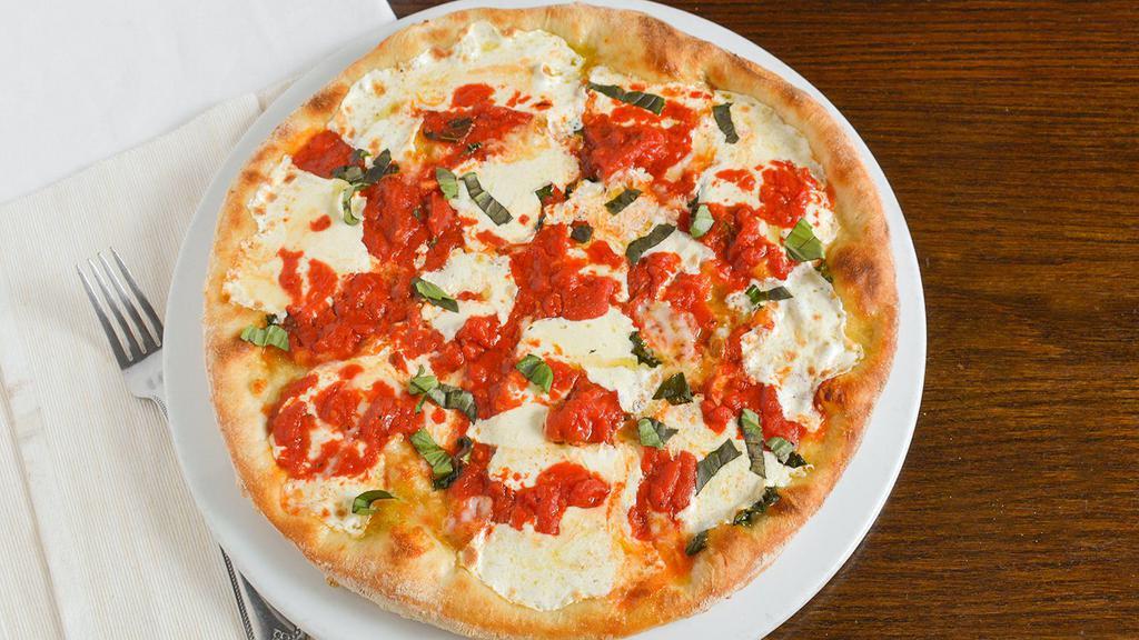 Traditional Margherita Pizza · Fior di latte and parmesan blend with chunky san marzano tomato sauce, extra virgin olive oil, and fresh basil.