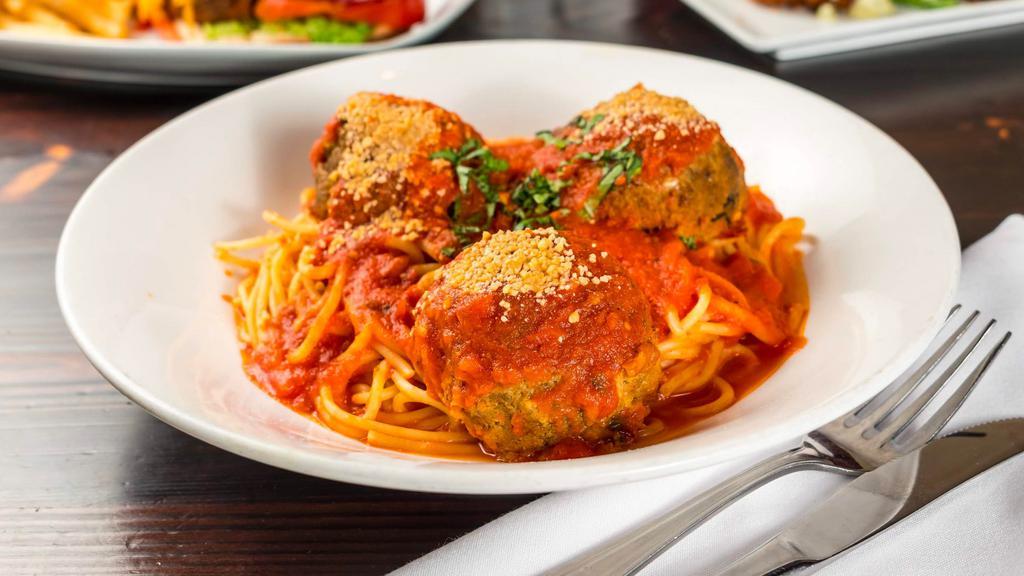 Vegan Spaghetti & Meatballs · Housemade Seitan Meatballs, Tomato Sauce and Cashew Parmesan.