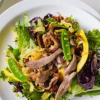 Aromatic Duck Salad · Candied pecan, sugar snap peas, mango, organic baby lettuce. Lime hoisin reduction.
