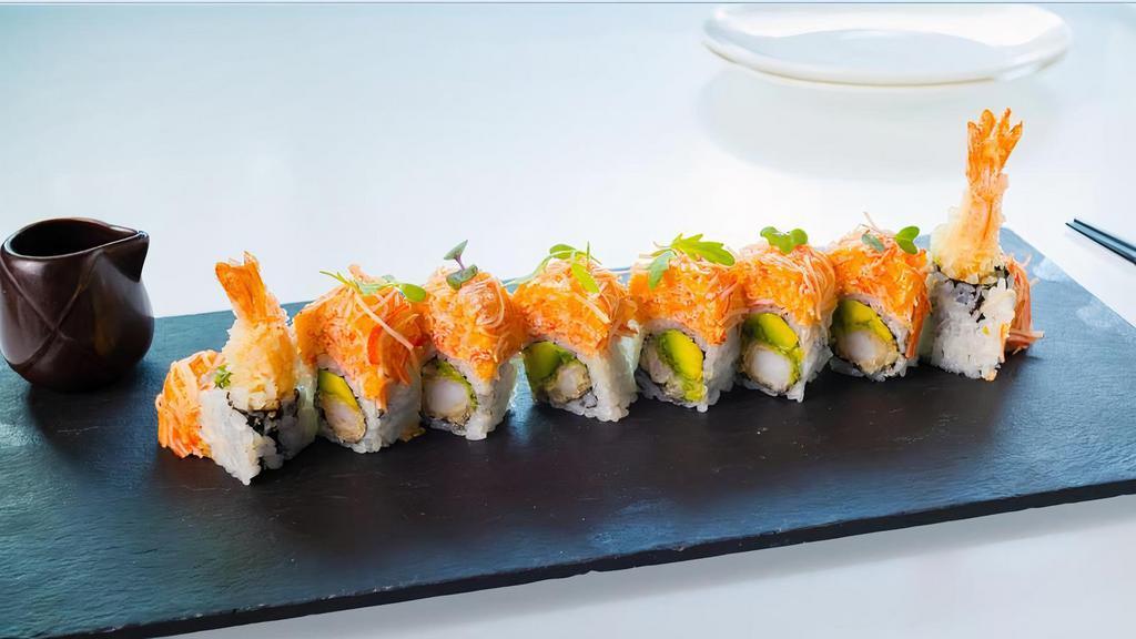 Angry Dragon Roll · Shrimp Tempura, avocado, topped with spicy kani. citrus sweet miso and eel sauce.