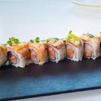 Out Of Control Roll · Yellowtail, tuna, salmon and asparagus roll, topped with seared yellowtail, salmon and tuna....