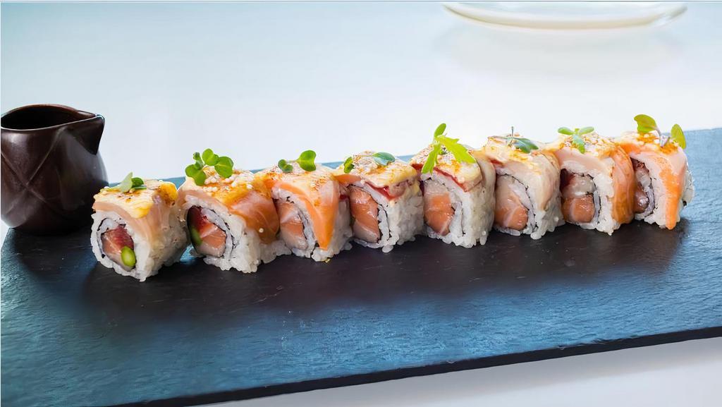 Out Of Control Roll · Yellowtail, tuna, salmon and asparagus roll, topped with seared yellowtail, salmon and tuna. Spicy miso, saikyo miso, eel sauce, crispy rice pearl.