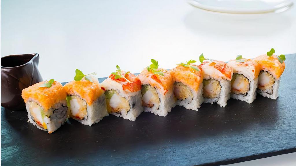 Lobster Roll · Lobster tempura, mango, cucumber roll, topped with spicy lobster and shrimp meat, sweet aioli and eel sauce.