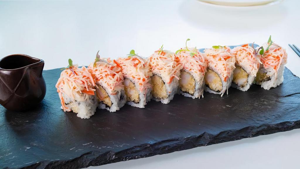 American Dream Roll · Rock shrimp tempura inside, topped with kani tartar, spicy creamy sauce.