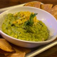 Guacamole · House made avocado dip, jalapeño, lime, red onion, cilantro, served with tortilla chips.