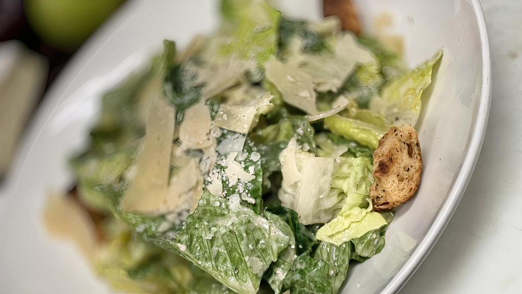 Caesar Salad · Romaine, garlic croutons, Parmesan, Caesar dressing.