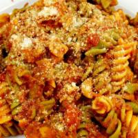 Tri-Color Spirale · Tri-color spirale pasta with chicken, fresh mozzarella, grape tomatos, tomato sauce topped w...