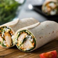 Chicken Caesar Wrap · Fresh wrap made with Grilled chicken, lettuce, tomato, onions, shaved Parmesan cheese and Ca...
