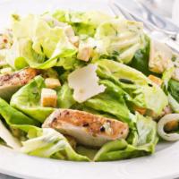 Chicken Caesar Salad · Grilled chicken served over lettuce, tomato, onions, shaved Parmesan cheese, and Caesar dres...