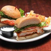 Crispy Buffalo Chicken Sandwich · Our all natural chicken breast fried in our famous breaded recipe, tossed in Buffalo sauce, ...