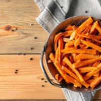 Sweet Potato Fries · Golden-crispy sweet potatoes fried and salted to perfection.